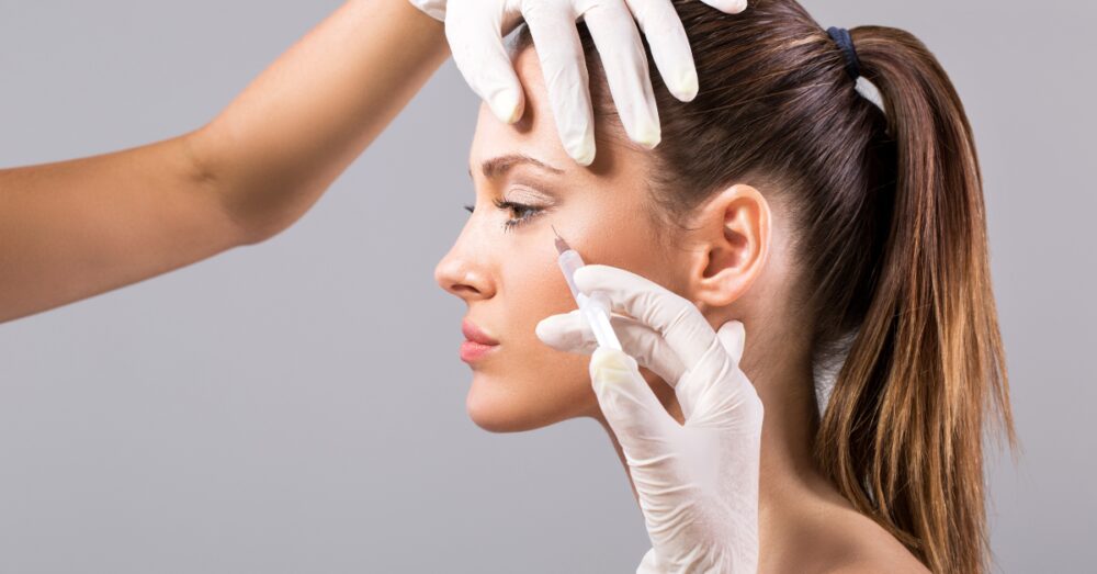 Provider administering a Dysport or Botox injection to a female