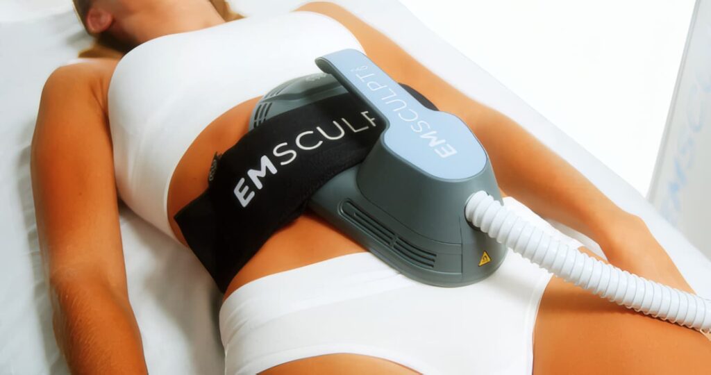 EMSCULPT NEO applicator positioned on a patient's abdomen during a core-strengthening body-contouring treatment at Hamilton Aesthetics in Palm Beach Gardens